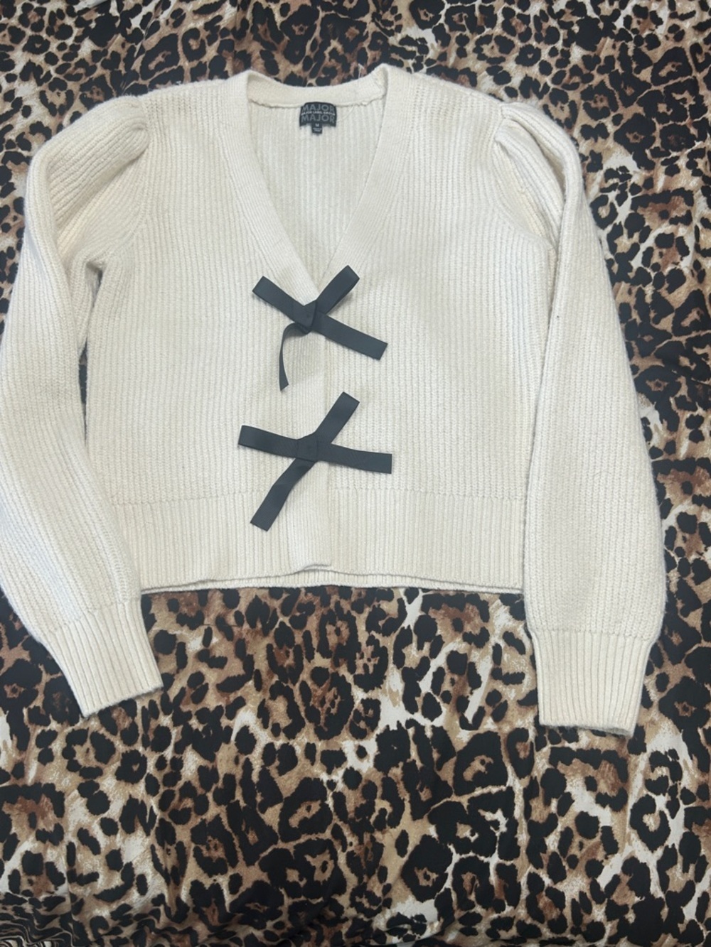 Majorelle Cream V-Neck Sweater with Black Bow Accents